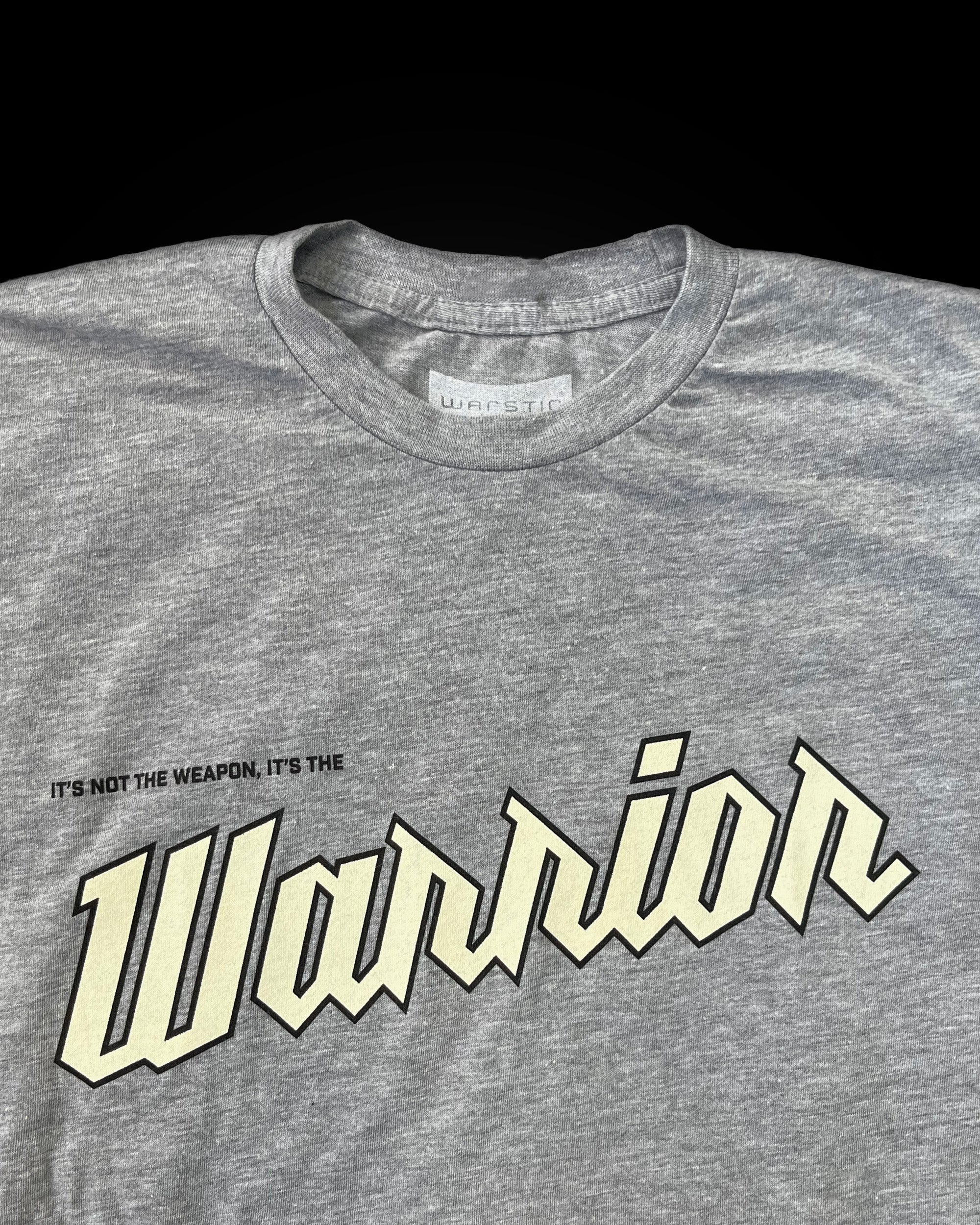 NOT THE WEAPON, THE WARRIOR TEE (GRAY)